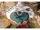 Aerial view of the private backyard pool with spa, water feature, surrounding patio, and mature trees at 3847 Sweet Bottom Dr, Duluth, GA 30096