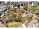 Overhead view of real estate featuring mature trees, landscaping, and multiple homes at 3847 Sweet Bottom Dr, Duluth, GA 30096
