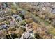 Aerial view of a leafy, upscale neighborhood with a winding river and waterfront properties at 3847 Sweet Bottom Dr, Duluth, GA 30096