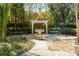 Secluded backyard oasis featuring a swing set, fountain, and elegant outdoor seating at 3847 Sweet Bottom Dr, Duluth, GA 30096