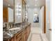 Elegant bathroom with a double vanity, marble countertop, and decorative tile flooring at 3847 Sweet Bottom Dr, Duluth, GA 30096