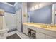 Cozy bathroom featuring a combination shower and bath and vanity space with a large mirror at 3847 Sweet Bottom Dr, Duluth, GA 30096