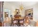 Refined dining room with hardwood floors, chandelier, and views of adjoining rooms at 3847 Sweet Bottom Dr, Duluth, GA 30096