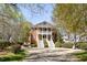 Elegant brick home with dual staircases, balconies, and manicured landscaping at 3847 Sweet Bottom Dr, Duluth, GA 30096
