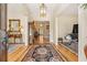Grand foyer with gleaming hardwood floors, elegant chandelier, and classic design at 3847 Sweet Bottom Dr, Duluth, GA 30096
