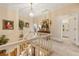 Upstairs hallway leading to the bath and featuring a classic staircase and decor at 3847 Sweet Bottom Dr, Duluth, GA 30096