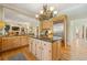 Well-designed kitchen with an island, stainless steel appliances, granite countertops, and wood cabinets at 3847 Sweet Bottom Dr, Duluth, GA 30096