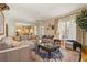 Open living room with hardwood floors connecting to the kitchen and offering ample seating at 3847 Sweet Bottom Dr, Duluth, GA 30096