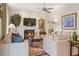 Bright living room showcasing a fireplace, hardwood floors, and elegant decor at 3847 Sweet Bottom Dr, Duluth, GA 30096