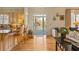 Inviting living space with hardwood floors, view to the outside porch, kitchen access, and comfortable seating at 3847 Sweet Bottom Dr, Duluth, GA 30096