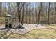 Community playground with slides, swings, and climbing structures surrounded by trees at 3847 Sweet Bottom Dr, Duluth, GA 30096