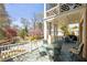 Relaxing screened-in porch with comfortable seating overlooking the lush backyard and pool at 3847 Sweet Bottom Dr, Duluth, GA 30096