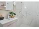 Bathroom featuring new vanity and shower area with decorative tile at 1013 Columbia Dr, Decatur, GA 30030