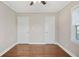 Bedroom showing hardwood floors and two closet doors at 1013 Columbia Dr, Decatur, GA 30030