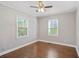 Cozy bedroom with two windows and hardwood flooring, offering natural light and comfort at 1013 Columbia Dr, Decatur, GA 30030