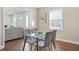 Cozy dining area featuring hardwood floors and a glass-top table with seating for four at 1013 Columbia Dr, Decatur, GA 30030