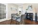 Dining area featuring modern table, and view into kitchen space at 1013 Columbia Dr, Decatur, GA 30030