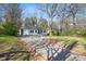 Charming single-story home with a driveway, manicured lawn and mature trees at 1013 Columbia Dr, Decatur, GA 30030