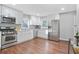 Modern kitchen featuring stainless steel appliances, white cabinetry, and ample counter space at 1013 Columbia Dr, Decatur, GA 30030