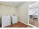 Convenient laundry room equipped with a washer and dryer, with hardwood floors at 1013 Columbia Dr, Decatur, GA 30030