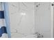 New shower with white marble-style tiling, offering a clean and modern look and feel at 1013 Columbia Dr, Decatur, GA 30030