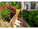 Backyard with landscaped terraces, a small seating area, and lush greenery at 3655 Brisbane Dr, Marietta, GA 30062