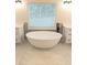 This bathroom features a modern soaking tub situated between two vanities at 3655 Brisbane Dr, Marietta, GA 30062