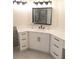 Bathroom vanity with white cabinets, quartz countertop, and modern black hardware at 3655 Brisbane Dr, Marietta, GA 30062