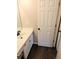 This bathroom features white cabinets and dark wood floors at 3655 Brisbane Dr, Marietta, GA 30062