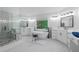 Bright bathroom features a soaking tub, marble shower, and dual vanities at 3655 Brisbane Dr, Marietta, GA 30062