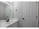 Neutral powder room boasts a modern sink, vanity, and updated fixtures at 3655 Brisbane Dr, Marietta, GA 30062