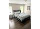 This bedroom offers lots of light, hardwood floors, and an ensuite bathroom at 3655 Brisbane Dr, Marietta, GA 30062