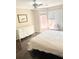 Bedroom with hardwood floors, large window, and natural light at 3655 Brisbane Dr, Marietta, GA 30062