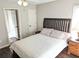 Light-filled bedroom with hardwood floors, ceiling fan, and adjacent room at 3655 Brisbane Dr, Marietta, GA 30062