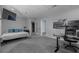 Spacious bedroom featuring a bed and home office at 3655 Brisbane Dr, Marietta, GA 30062