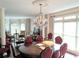 A formal dining area features a chandelier, bay window, and hardwood floors at 3655 Brisbane Dr, Marietta, GA 30062