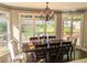 Sunlit dining room with a large window and classic chandelier, perfect for Gathering gatherings at 3655 Brisbane Dr, Marietta, GA 30062