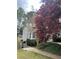 Home exterior surrounded by mature trees and green foliage, providing shade and privacy to the residence at 3655 Brisbane Dr, Marietta, GA 30062