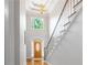 Elegant foyer with soaring ceilings, hardwood floors, chandelier and a grand staircase at 3655 Brisbane Dr, Marietta, GA 30062