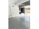 Garage with painted floors, ample lighting, and a door leading to the outside for convenient access at 3655 Brisbane Dr, Marietta, GA 30062