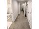 Hallway features a bathroom, storage closet, and access to the basement at 3655 Brisbane Dr, Marietta, GA 30062