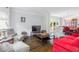 Bright living room featuring hardwood floors, large windows, elegant furnishings, and access to the dining room at 3655 Brisbane Dr, Marietta, GA 30062