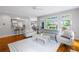 Cozy living room with hardwood floors, a neutral palette, plush seating, and views of the outdoor garden at 3655 Brisbane Dr, Marietta, GA 30062