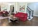 An elegant living room showcases hardwood floors and offers access to the dining room and stairway at 3655 Brisbane Dr, Marietta, GA 30062