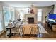 A cozy living room features a fireplace, hardwood floors, and large windows at 3655 Brisbane Dr, Marietta, GA 30062