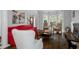 Inviting living room with hardwood floors, a red sofa, and stylish chairs at 3655 Brisbane Dr, Marietta, GA 30062