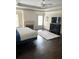 A large main bedroom features hardwood floors, fireplace, and a tray ceiling at 3655 Brisbane Dr, Marietta, GA 30062