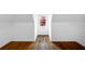Walk-in closet boasts wood flooring, white walls, and natural light at 3655 Brisbane Dr, Marietta, GA 30062