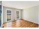 Well-lit bedroom with hardwood flooring and a view of the landscaped front yard at 4433 Canary Ct, Lithia Springs, GA 30122