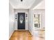 Inviting entryway boasting gleaming hardwood floors and a stylish front door at 4433 Canary Ct, Lithia Springs, GA 30122